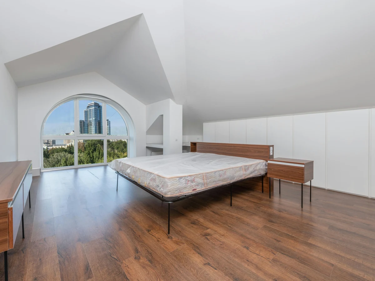 Minimalist white bedroom painted by Richmond Decorators in Richmond upon Thames