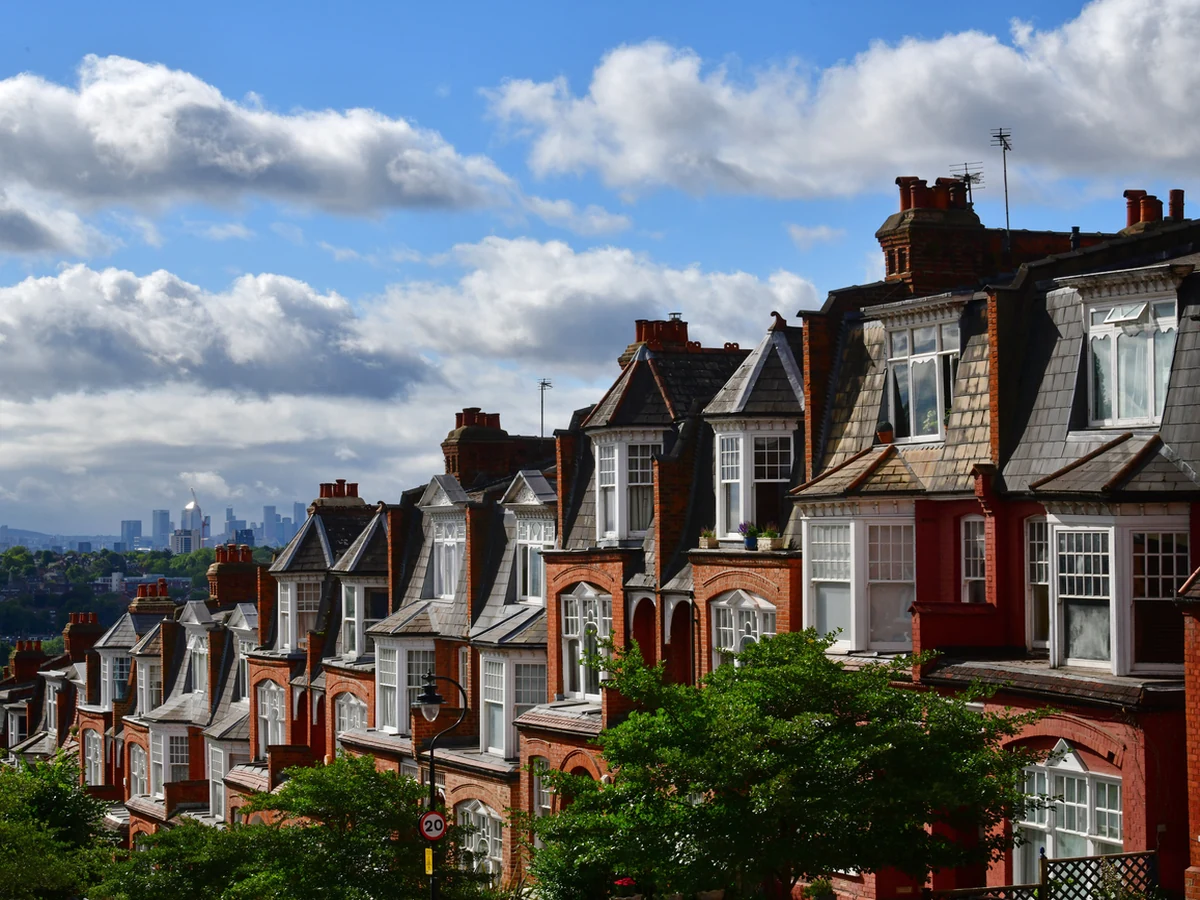 Row of Victorian red brick houses exterior painting by Richmond Decorators in Barnes