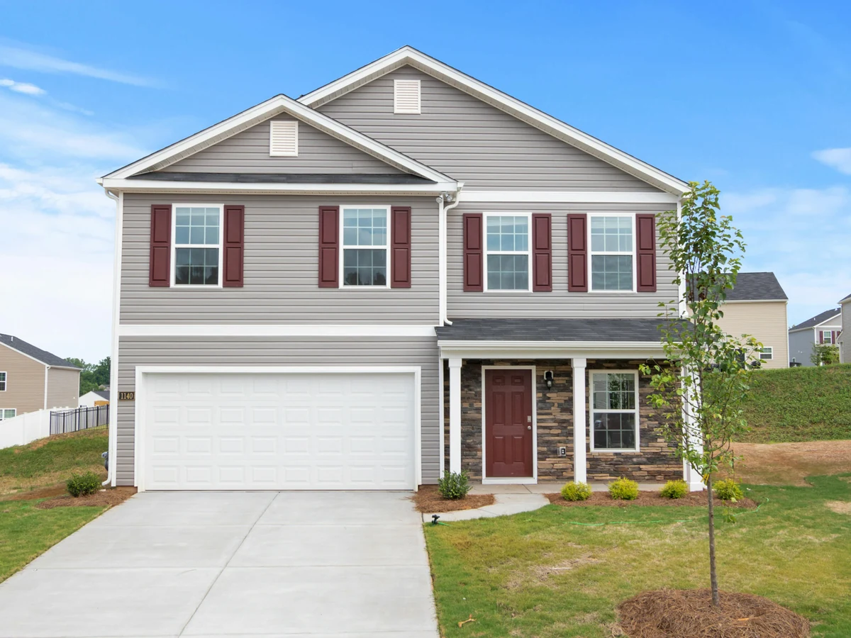 Suburban two-storey house exterior painting in Hampton TW12 by Richmond Decorators