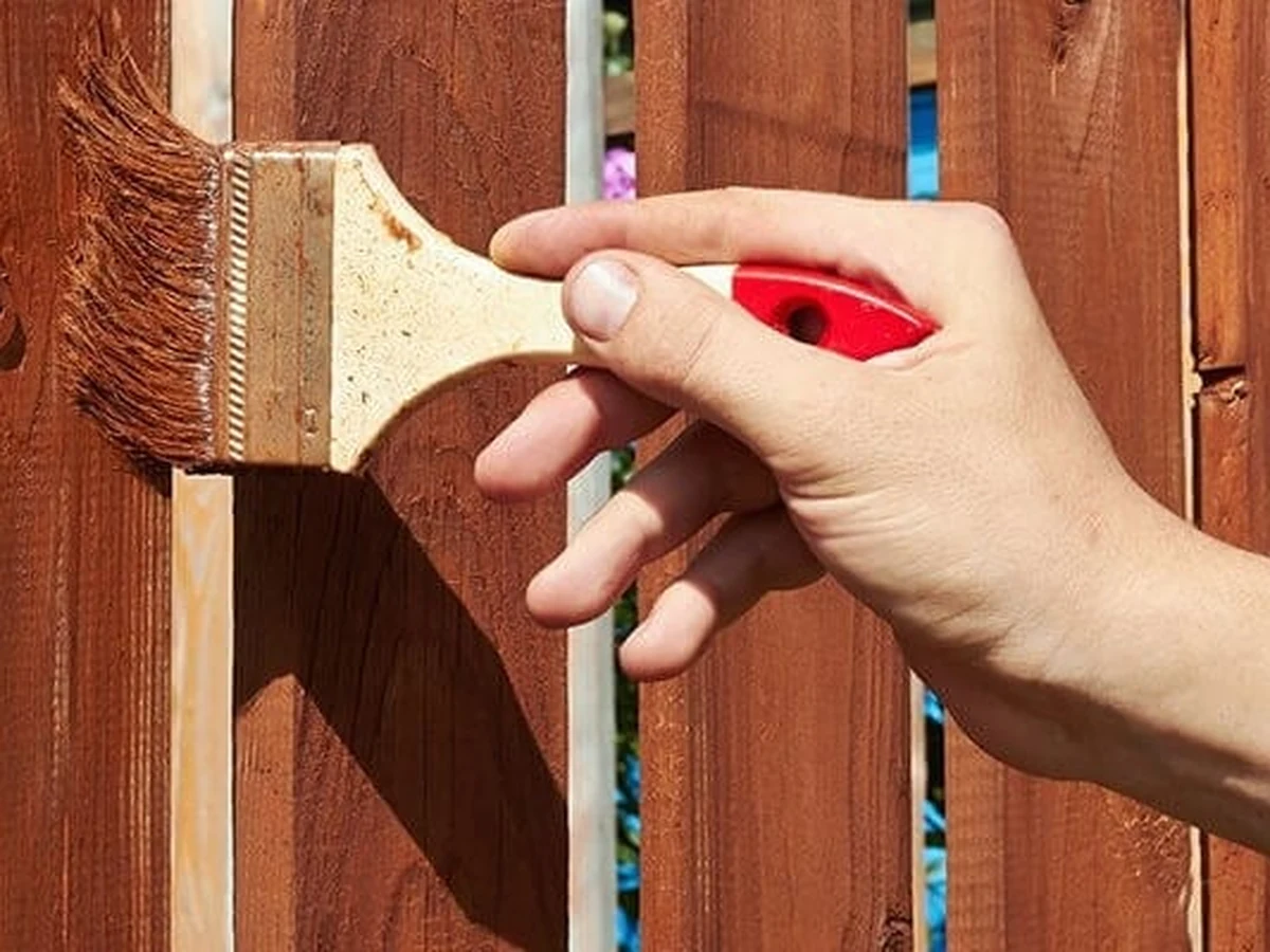 Fence painting in Whitton — wooden garden fence treatment by Richmond Decorators