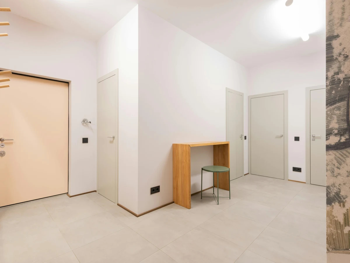interior-painting-small-empty-room-richmond-decorators-2 A small empty room with a wooden desk and white walls