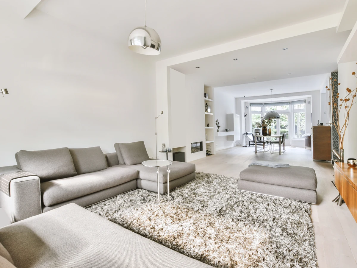 Open plan white living room interior painting in East Sheen by Richmond Decorators