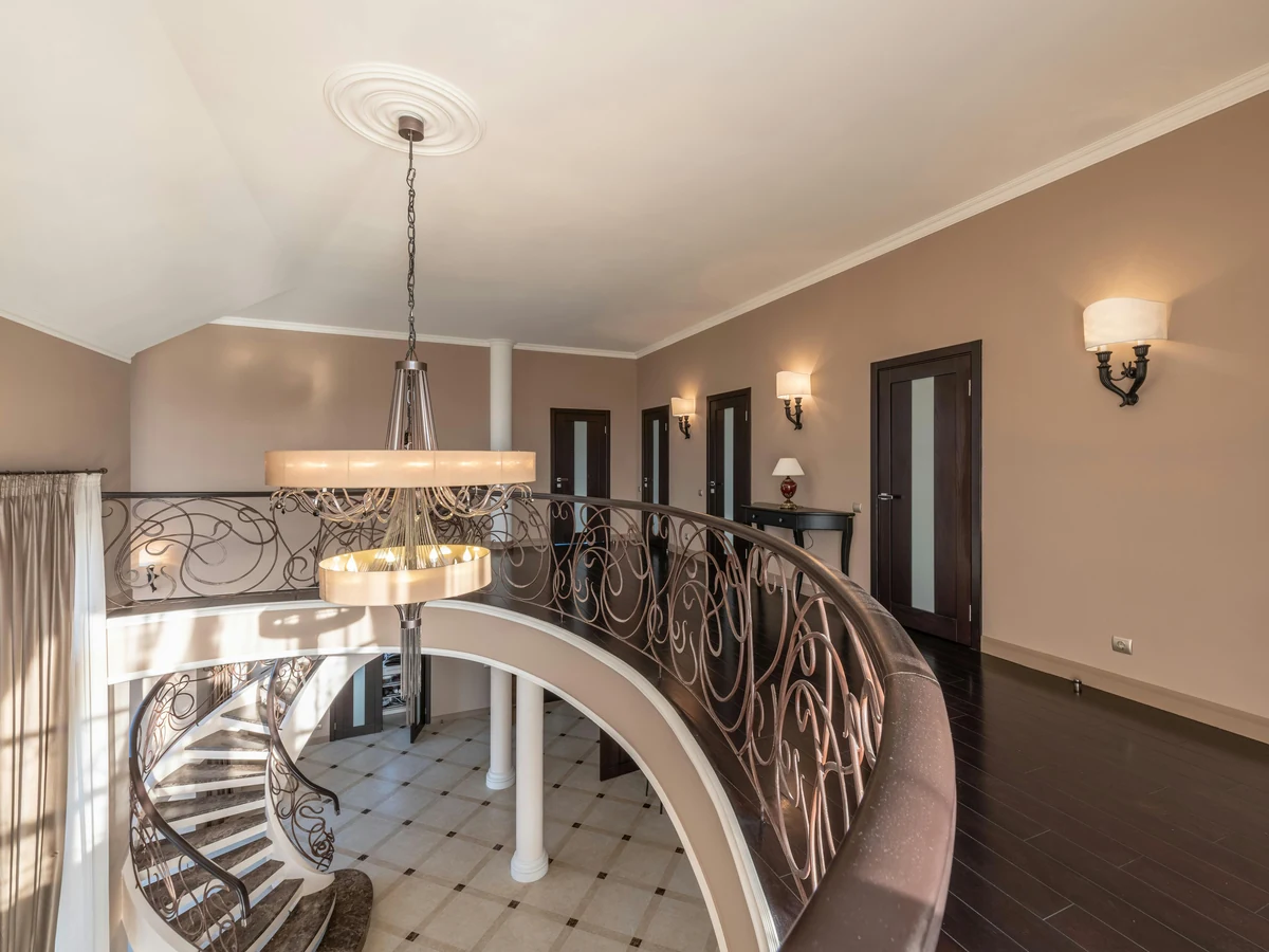 Local decorating expertise in Richmond - grand curved staircase by Richmond Decorators