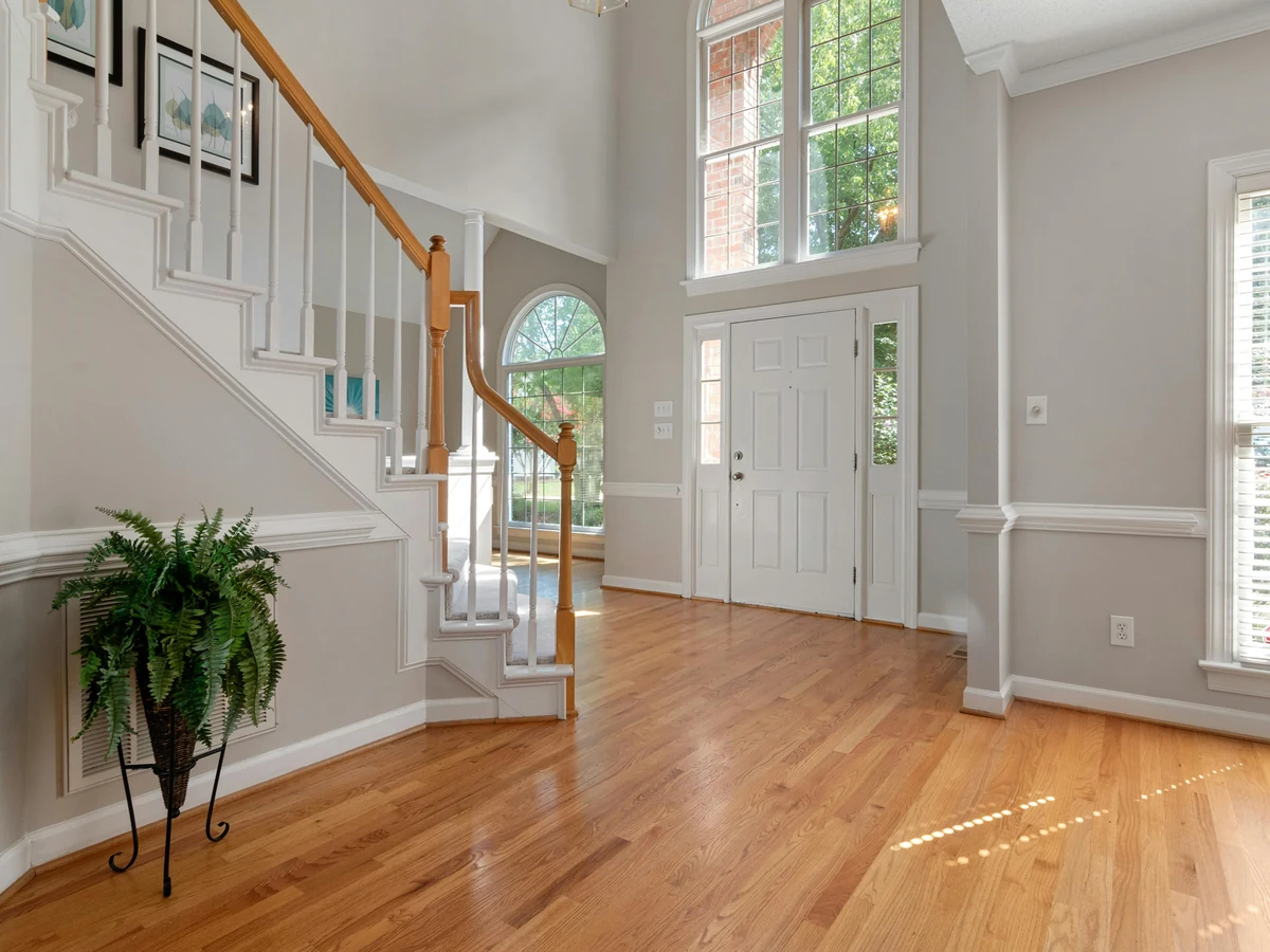 Grand hallway and staircase painting in Chiswick Edwardian villa by Richmond Decorators