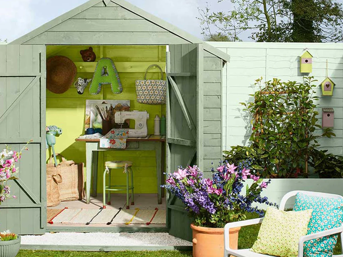 Freshly painted green garden timber structure by Richmond Decorators